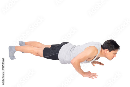 Serious man in activewear performing push ups