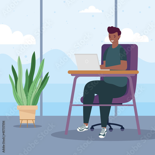 afro boy using laptop