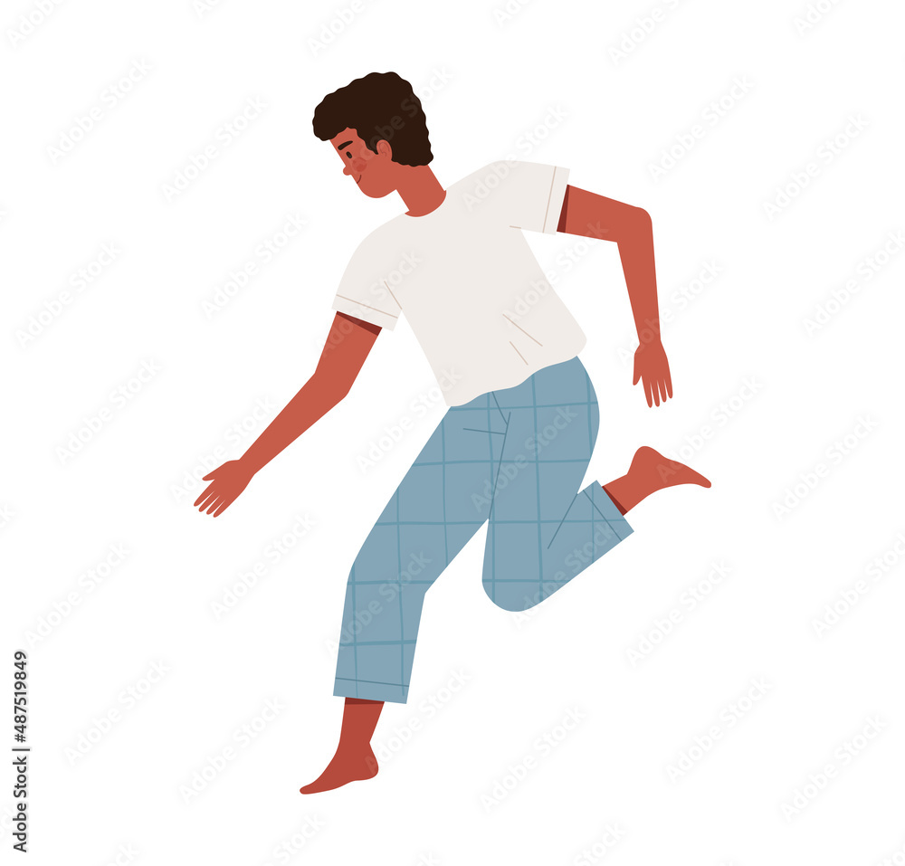 Young man in comfortable pajamas cheerfully jumps or dances after waking up. Good morning and healthy sleep concept. Young man in comfortable pajamas cheerfully jumps or dances after waking up. Good morning and healthy sleep concept.
