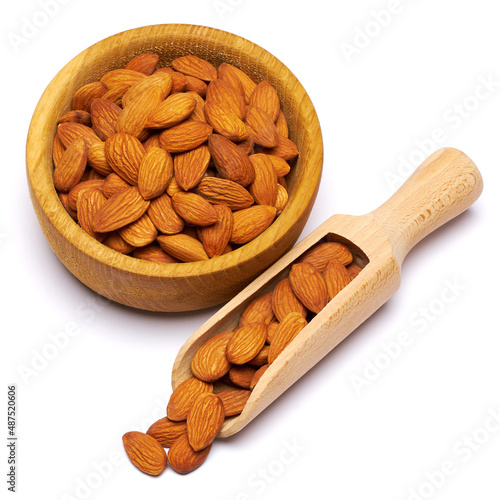 Wooden Scoop and bowl full of Almond nuts isolated on a white background