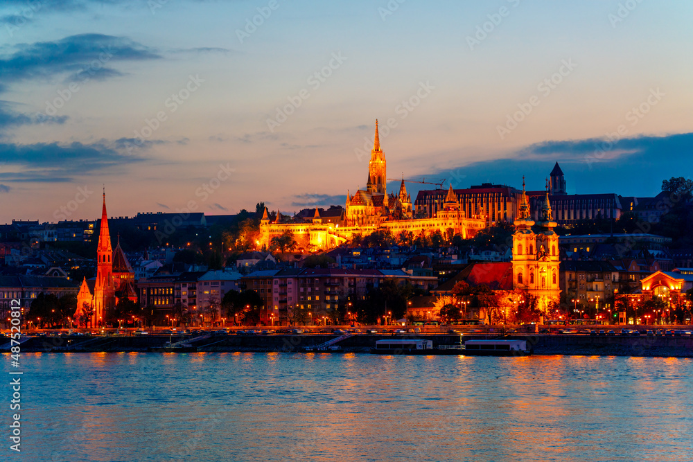 Wonderful mesmerizing view of the city at night illuminated by lights on the danube river. Beautiful landscape on the parliament on the river. Wonderful architecture at night. Hungary, budapest