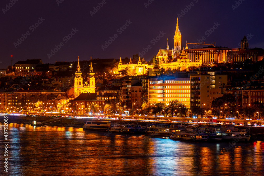 Wonderful mesmerizing view of the city at night, illuminated by lights, on the danube river. Hungary, budapest. Magic architecture at night. Beautiful landscape on the parliament on the river.