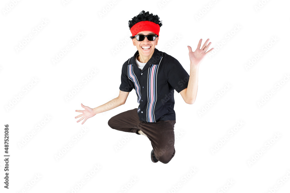 Jumping guy opening her arms smiling looking at camera, wearing an afro wig and sunglasses. Retro 90s style. Isolated on white background. Latin 18-20 years old guy. Jumping guy opening her arms smiling looking at camera, wearing an afro wig and sunglasses. Retro 90s style. Isolated on white background. Latin 18-20 years old guy.