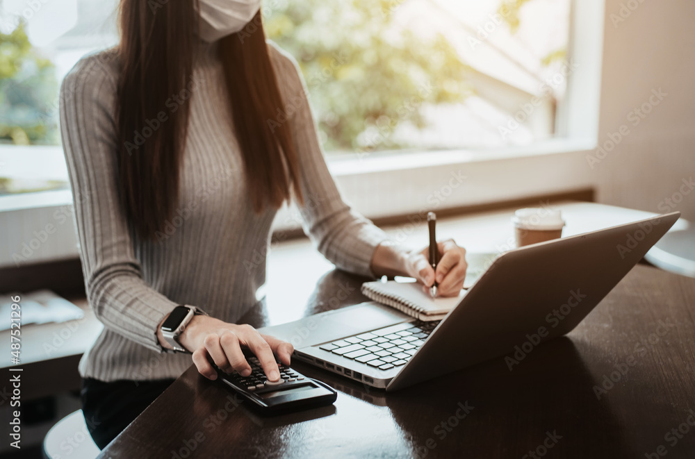 Businessmen are calculating income-expenditure and analyzing real estate investment data at office, Accounting Financial and tax systems concept. Businessmen are calculating income-expenditure and analyzing real estate investment data at office, Accounting Financial and tax systems concept.