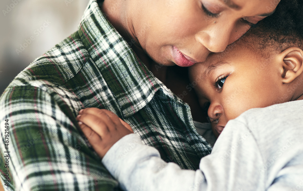 Motherly tenderness. Shot of a mother cradling her little baby boy. Motherly tenderness. Shot of a mother cradling her little baby boy.