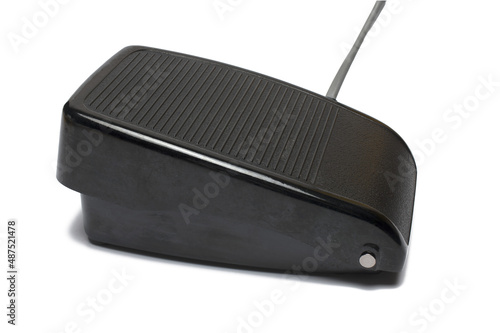 Closeup foot switch sewing machine white background