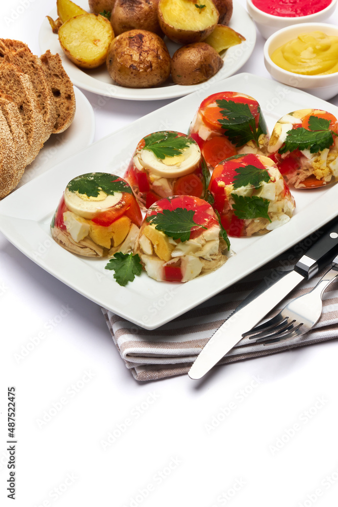 Portion of delicious chicken aspic on a plate isolated on white background Portion of delicious chicken aspic on a plate isolated on white background