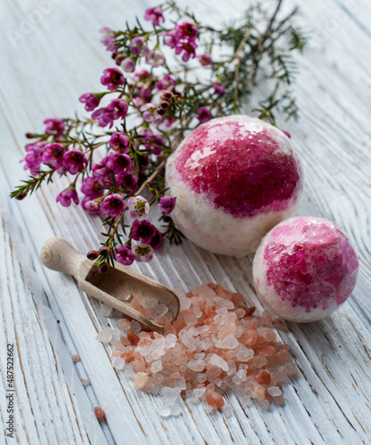 salt bomb with impurities of dried rose on a white background. handmade