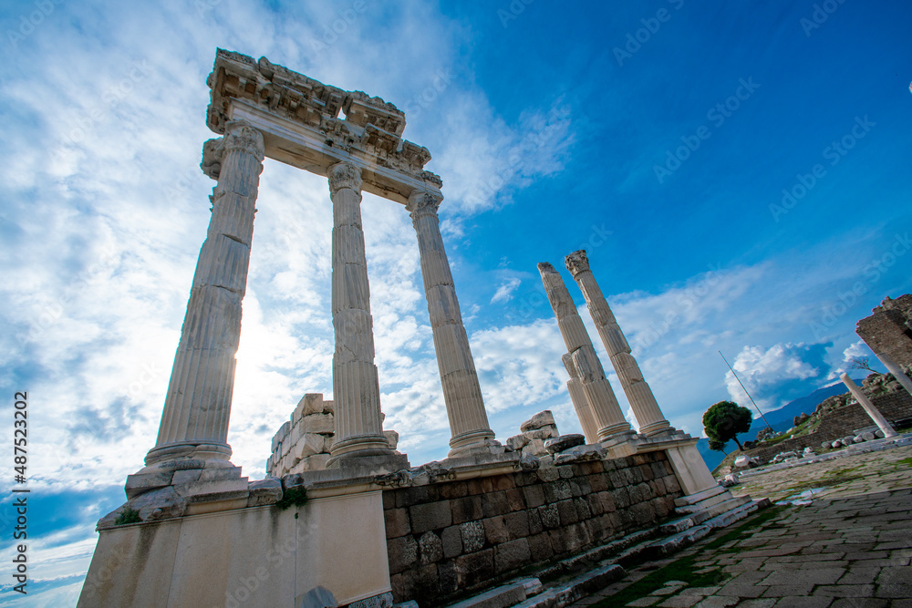 Turkey, izmir. Ancient ruins against a bright blue sky. Tall antique columns. Destroyed buildings