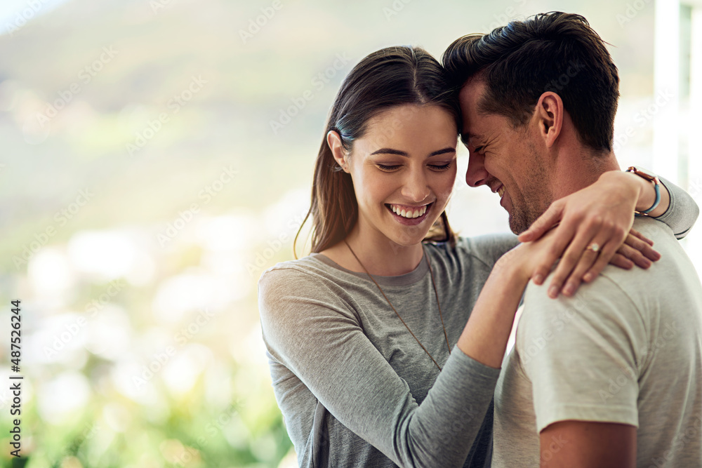 Fototapeta premium Falling deeper in love every moment theyre together. Shot of a happy young couple in a loving embrace.