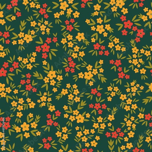 Seamless vintage pattern. Small yellow and red flowers  green leaves. Dark green background. vector texture. fashionable print for textiles  wallpaper and packaging.
