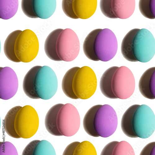 Seamless Pattern made of chicken eggs on white background. Minimal food concept. Happy easter. blue,pink, purple, yellow chicken egg