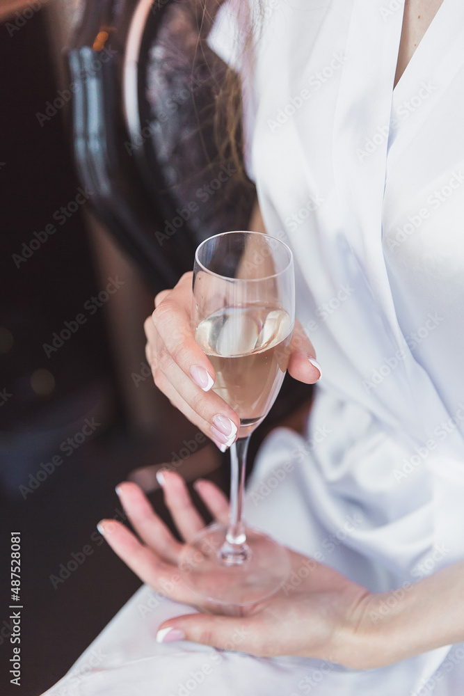 the bride in an exquisite white dress drink champagne the bride in an exquisite white dress drink champagne