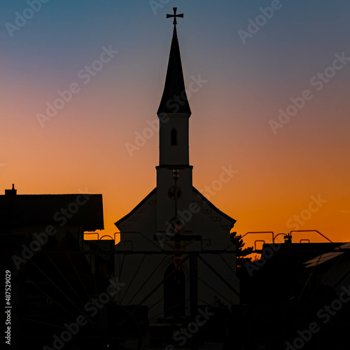 Beautiful sunset with a church silhouette at Eichendorf  Bavaria  Germany