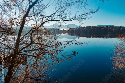 Beautiful autumn or indian summer view with reflections at the famous Abtsee lake, Saaldorf, Bavaria, Germany photo