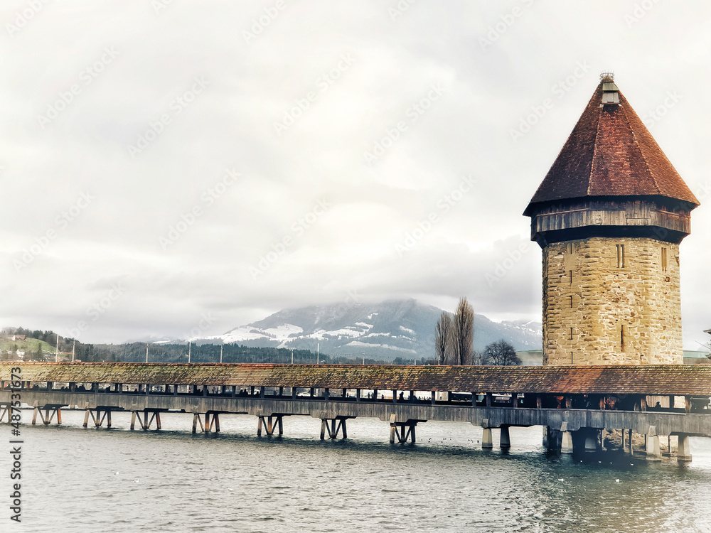 The Chapel Bridge the oldest wooden bridge in the world.There is an octagonal fortress in the middle of the bridge.Is another symbol and history of Lucerne .