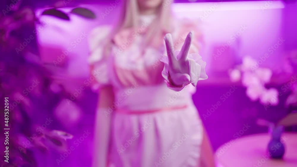 Headless pink maid cosplay show piece sign gesture with fingers in kitchen 4K Headless pink maid cosplay show piece sign gesture with fingers in kitchen 4K