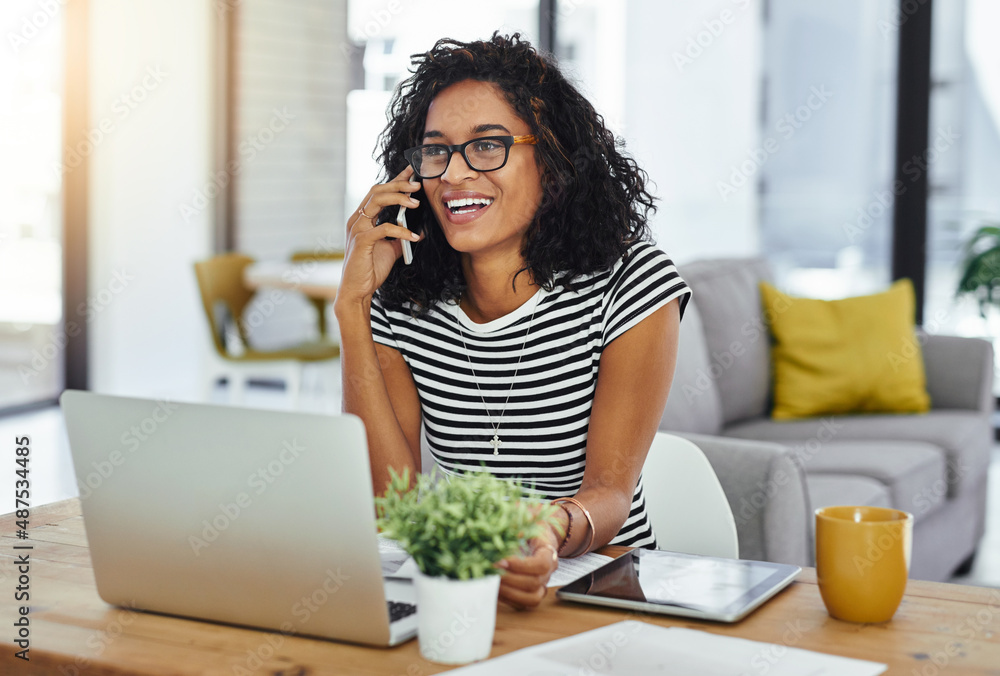 Contacting all creatives to get connected. Shot of a young woman working from home. Contacting all creatives to get connected. Shot of a young woman working from home.