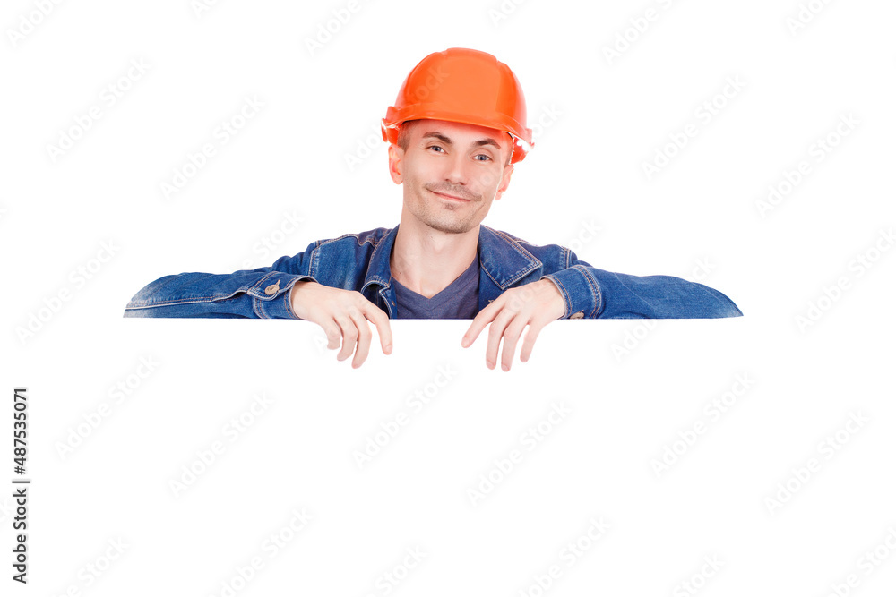 Builder in an orange hard hat with a happy face, isolated on white background. Cheerful male industrial engineer in uniform. Safety equipment. Space for text. Builder in an orange hard hat with a happy face, isolated on white background. Cheerful male industrial engineer in uniform. Safety equipment. Space for text.