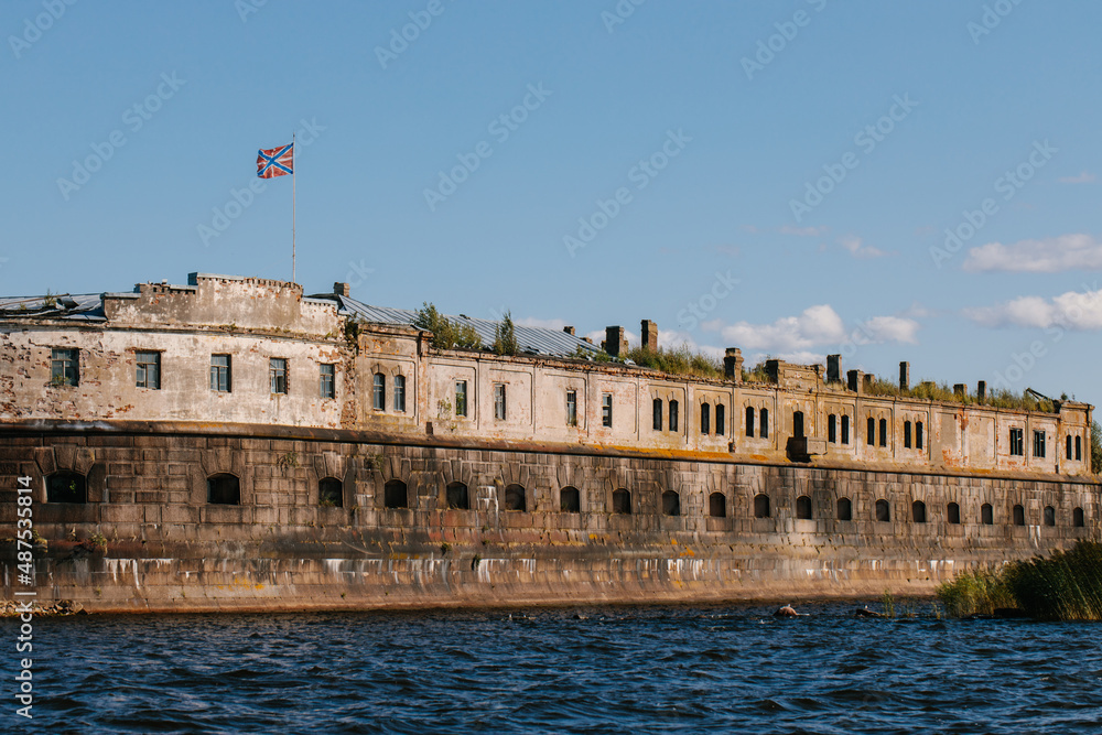 View from the water of the oldest fort Kronshlot and the lower sash lighthouse in the waters of the Gulf of Finland in Kronstadt,crown castle,defensive fortress