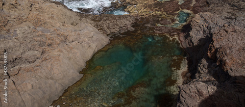 North of Gran Canaria, rockpools and natural swimming pools around Faro de Sardina lighthouse, 
the group called Espejos del Norte, i.e. Mirrors of the North photo