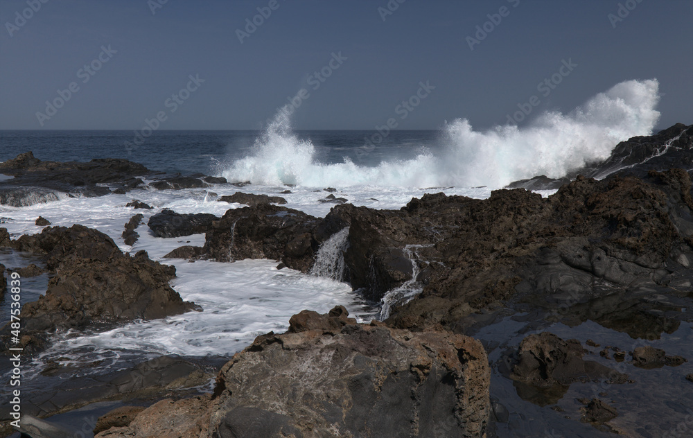 Gran Canaria, north coast, rockpools around Puertillo de Banaderos area protected from the 
ocean waves by volcanic rock barrier