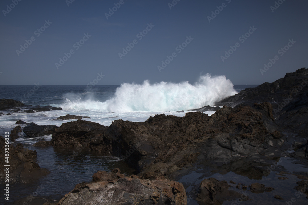 Gran Canaria, north coast, rockpools around Puertillo de Banaderos area protected from the 
ocean waves by volcanic rock barrier