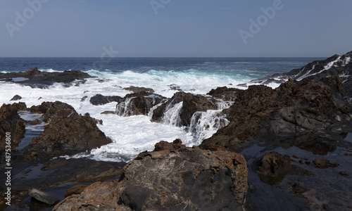 Gran Canaria, north coast, rockpools around Puertillo de Banaderos area protected from the ocean waves by volcanic rock barrier