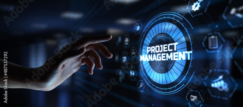 Project management planning business development. Hand pressing button on screen. © Murrstock