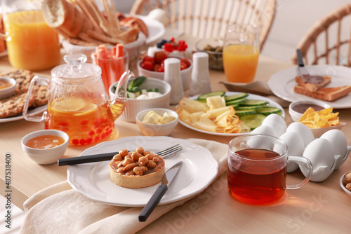 Dishes with different food on table indoors. Luxury brunch