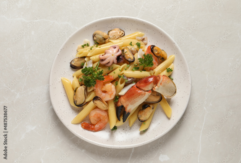 Delicious pasta with sea food on light grey table, top view Delicious pasta with sea food on light grey table, top view