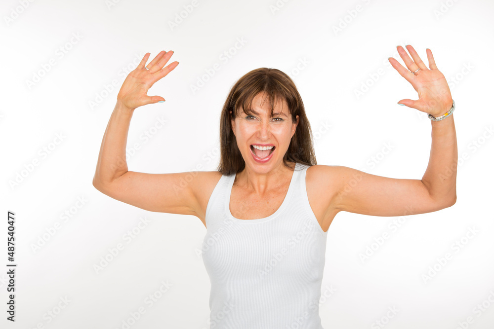 adult Caucasian woman expressing joy and elation looking at camera on white background adult Caucasian woman expressing joy and elation looking at camera on white background