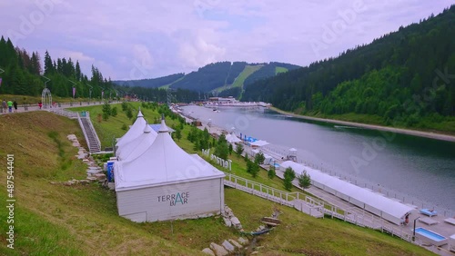 The green banks of Molodist Lake, Bukovel, Carpathians, Ukraine photo