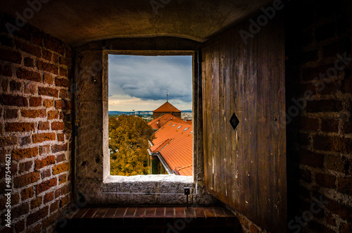 View on Wawel Castle roof through the window photo