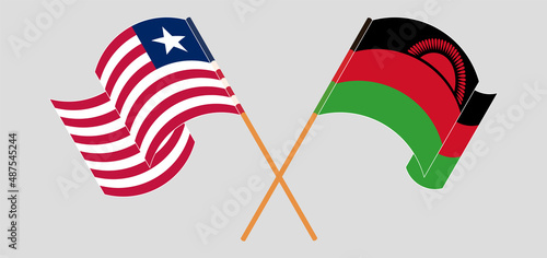 Crossed and waving flags of Liberia and Malawi