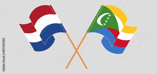 Foto Crossed and waving flags of the Netherlands and Comoros