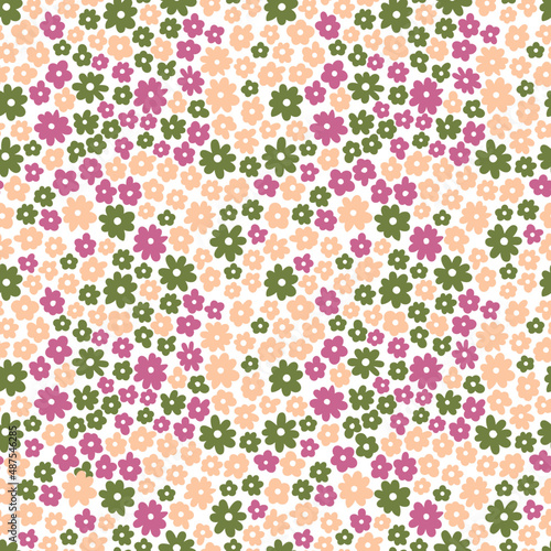 Colorful floral pattern in childish style. Seamless background with green, pink, and violet flowers. Texture for fabric, wrapping paper, stationery, textile, wallpapers.