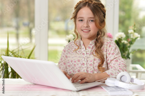 beautiful young girl with laptop studying