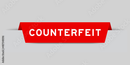 Red color inserted label with word counterfeit on gray background