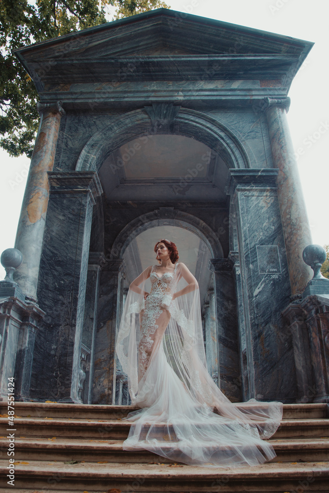 young woman bride posing in beautiful dress