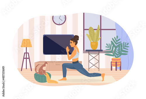 Active flexible woman practicing yoga at home.