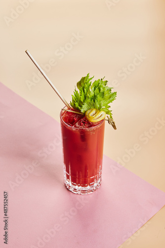 Cold alcoholic or non-alcoholic cocktail on pastel background. Hard light, deep shadow.