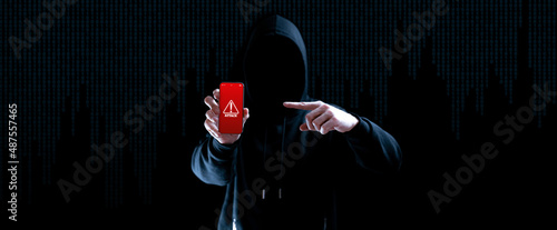 Cyber security hacker smartphone. Internet web hack technology. Digital mobile phone in hacker man hand isolated on black banner. Data protection, secured internet access, cybersecurity. photo