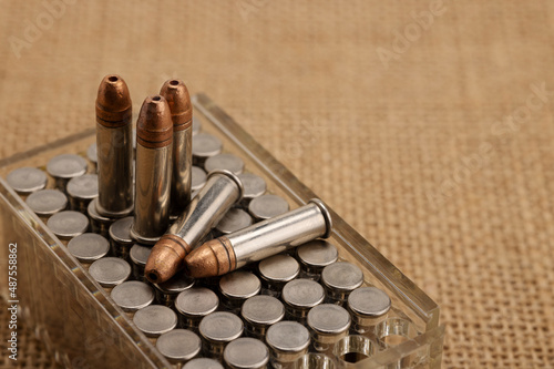 Hollow-point .22 LR bullets , Close up of .22 ammunition on burlap background photo
