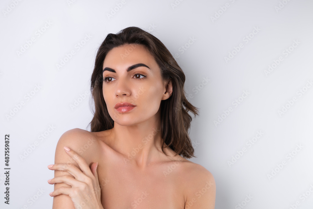 Close-up beauty portrait of a topless woman with perfect skin and natural make-up Close-up beauty portrait of a topless woman with perfect skin and natural make-up