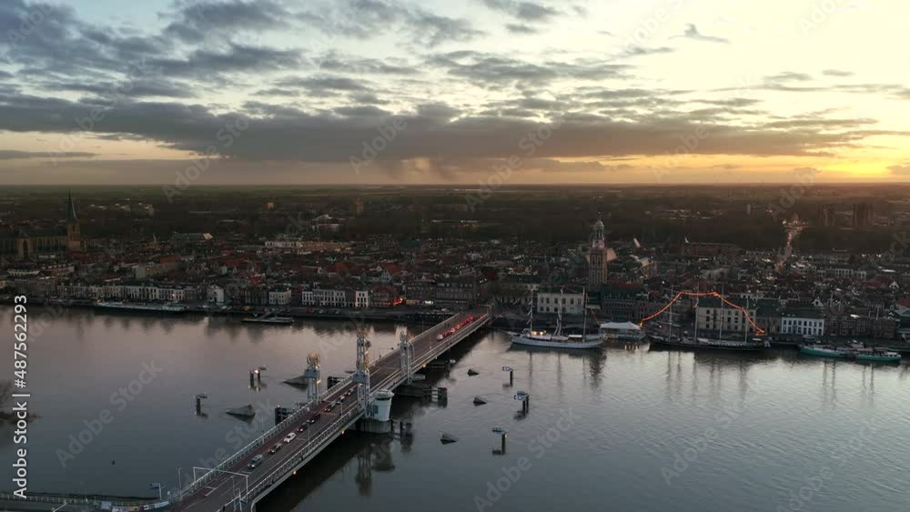 Kampen city skyline aerial view from the river IJssel with the sunset in the distance during a cold winter evening. Kampen city skyline aerial view from the river IJssel with the sunset in the distance during a cold winter evening.