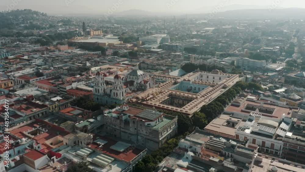 Aerial View Of Church Of La Compania Next To Old University Building In Historic City Centre Of Puebla In Mexico. drone shot Aerial View Of Church Of La Compania Next To Old University Building In Historic City Centre Of Puebla In Mexico. drone shot