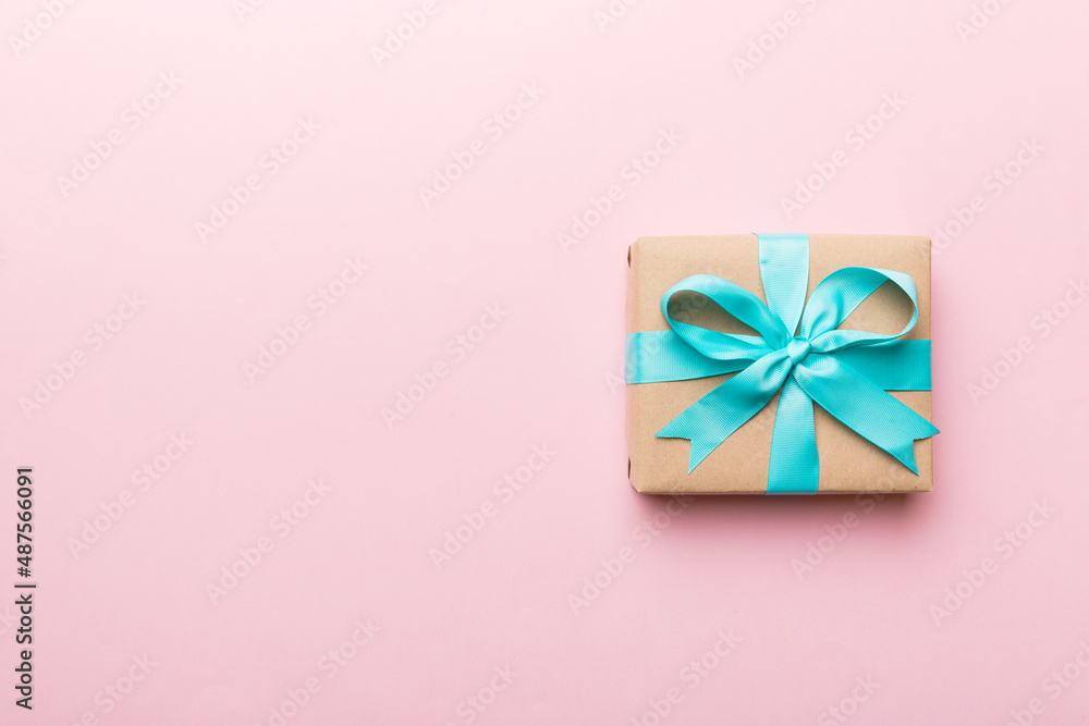 Holiday present box over colored background, top view. Copy space for design Holiday present box over colored background, top view. Copy space for design