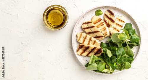 Photography Grilled Halloumi cheese salad on white plate, Cyprus squeaky cheese