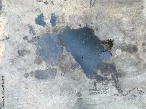Car engine oil stains on the cement floor